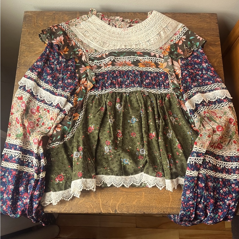 Farm Rio patchwork blouse with lace accents in size M.